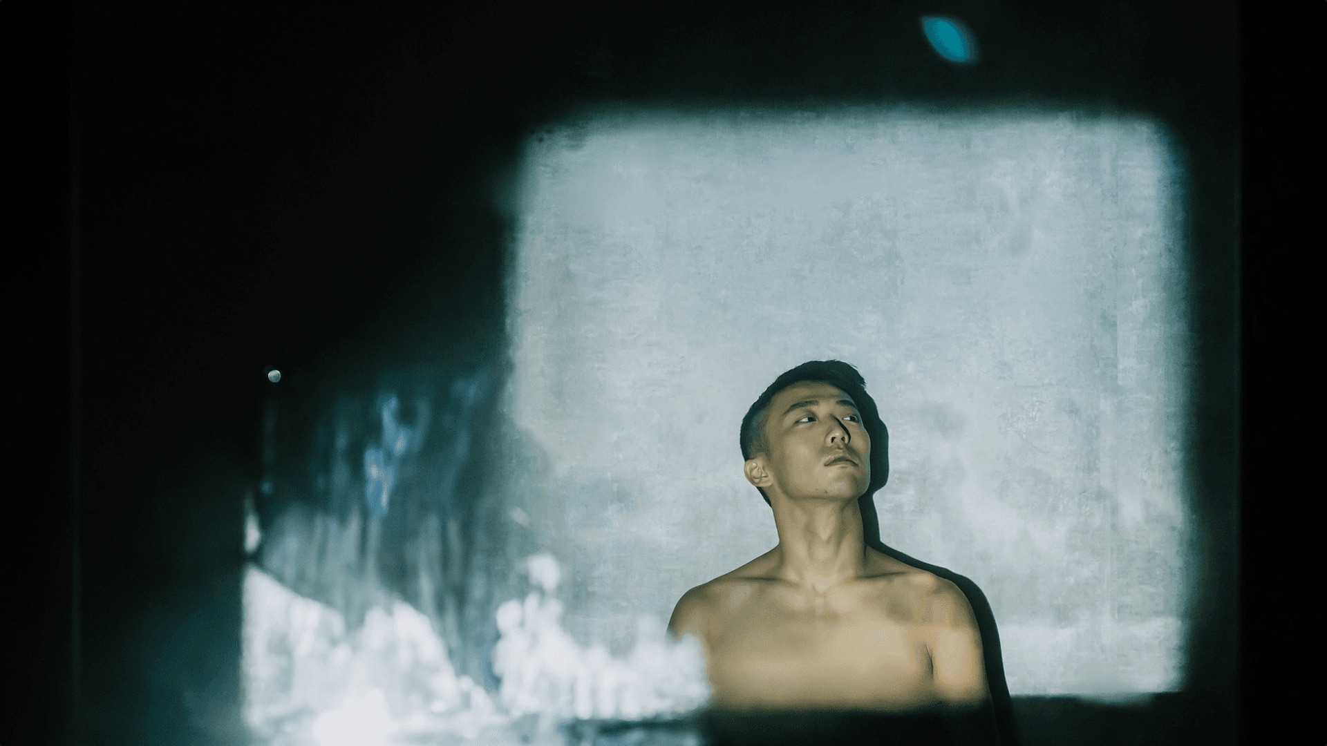 Man looking up in mist