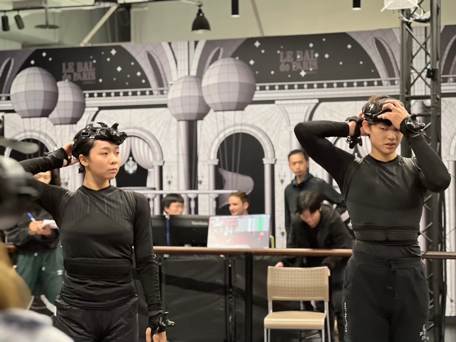 Performers putting on VR headsets