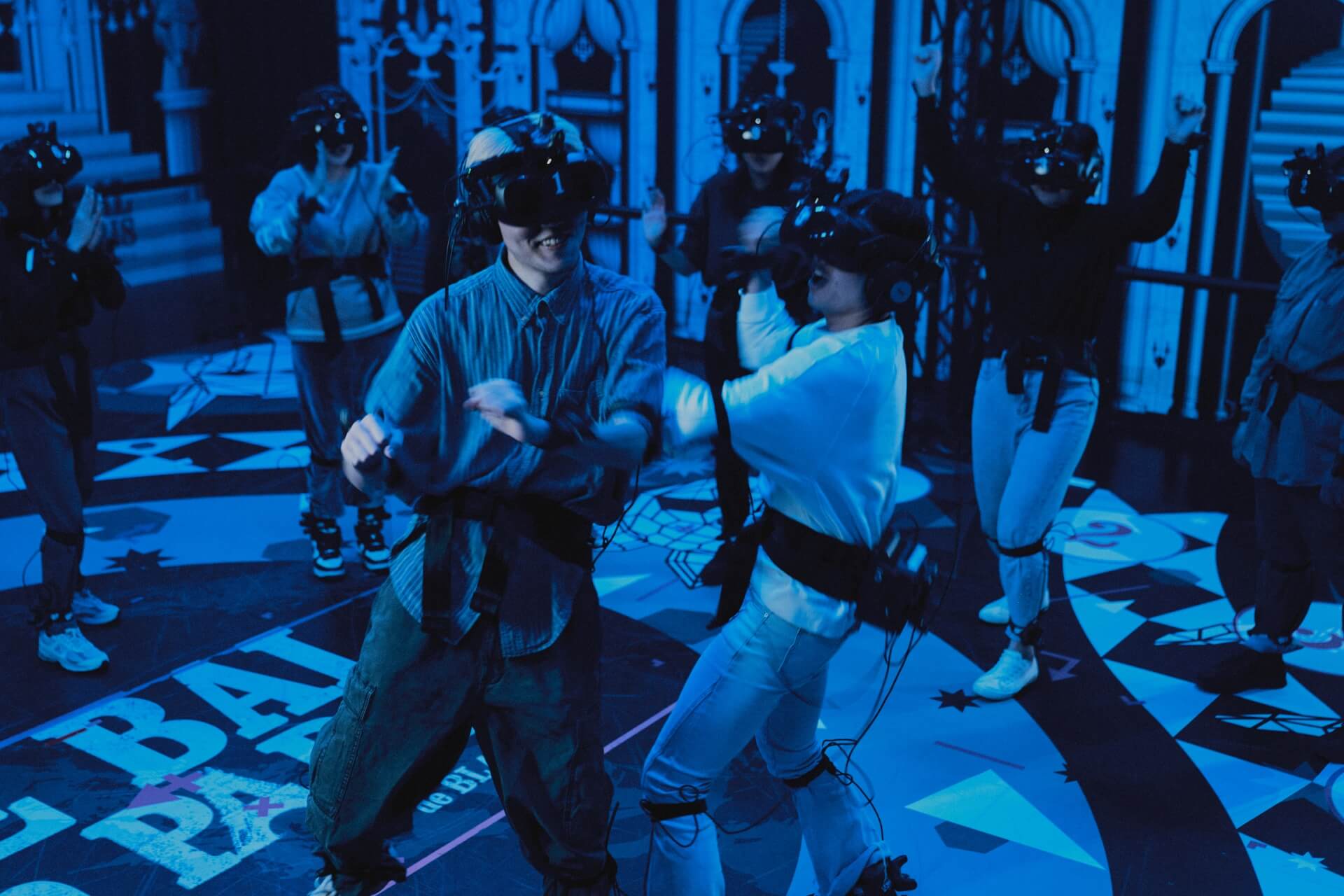 Audience dancing together in free-roam VR