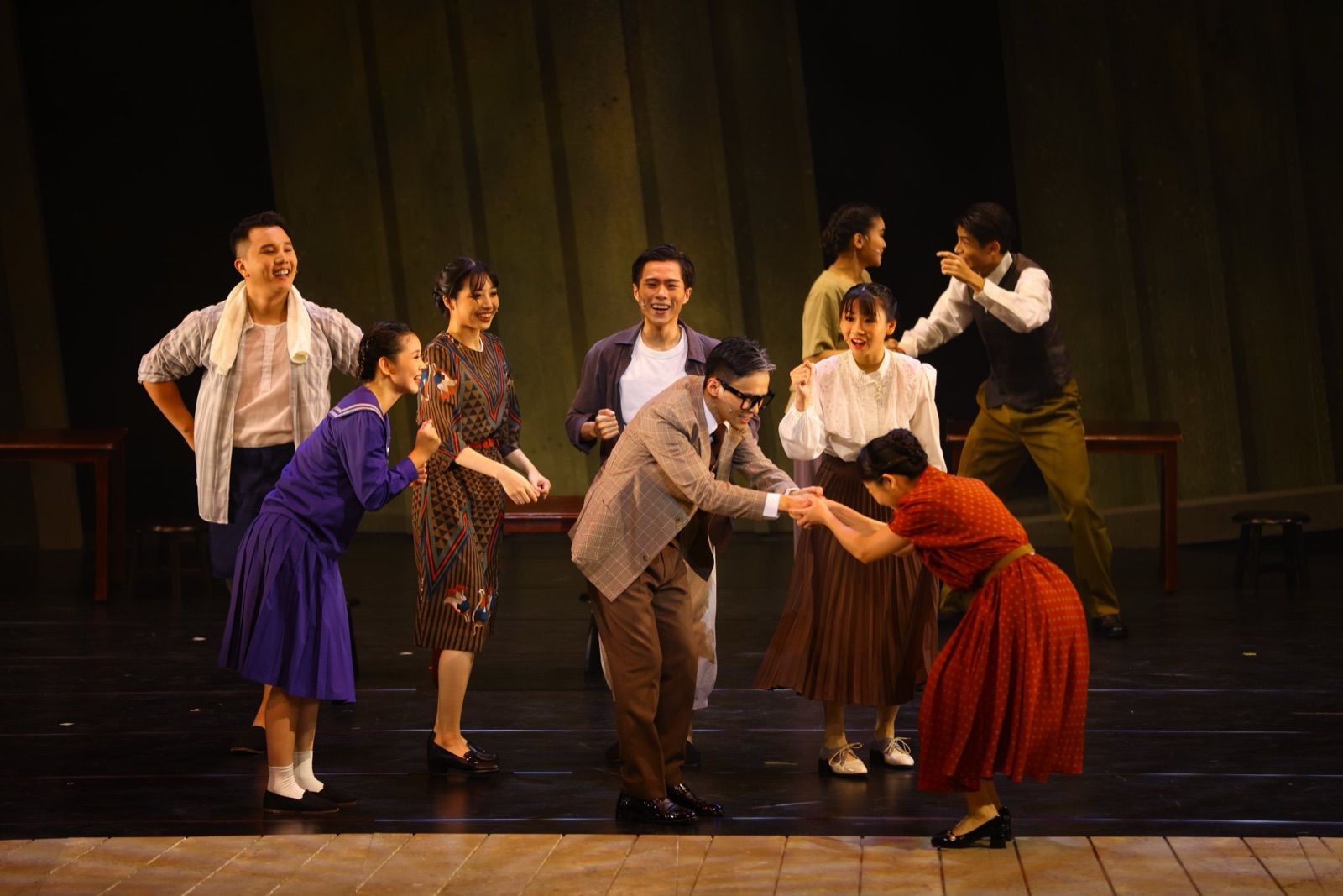 Joyful group dance scene in warm period costumes