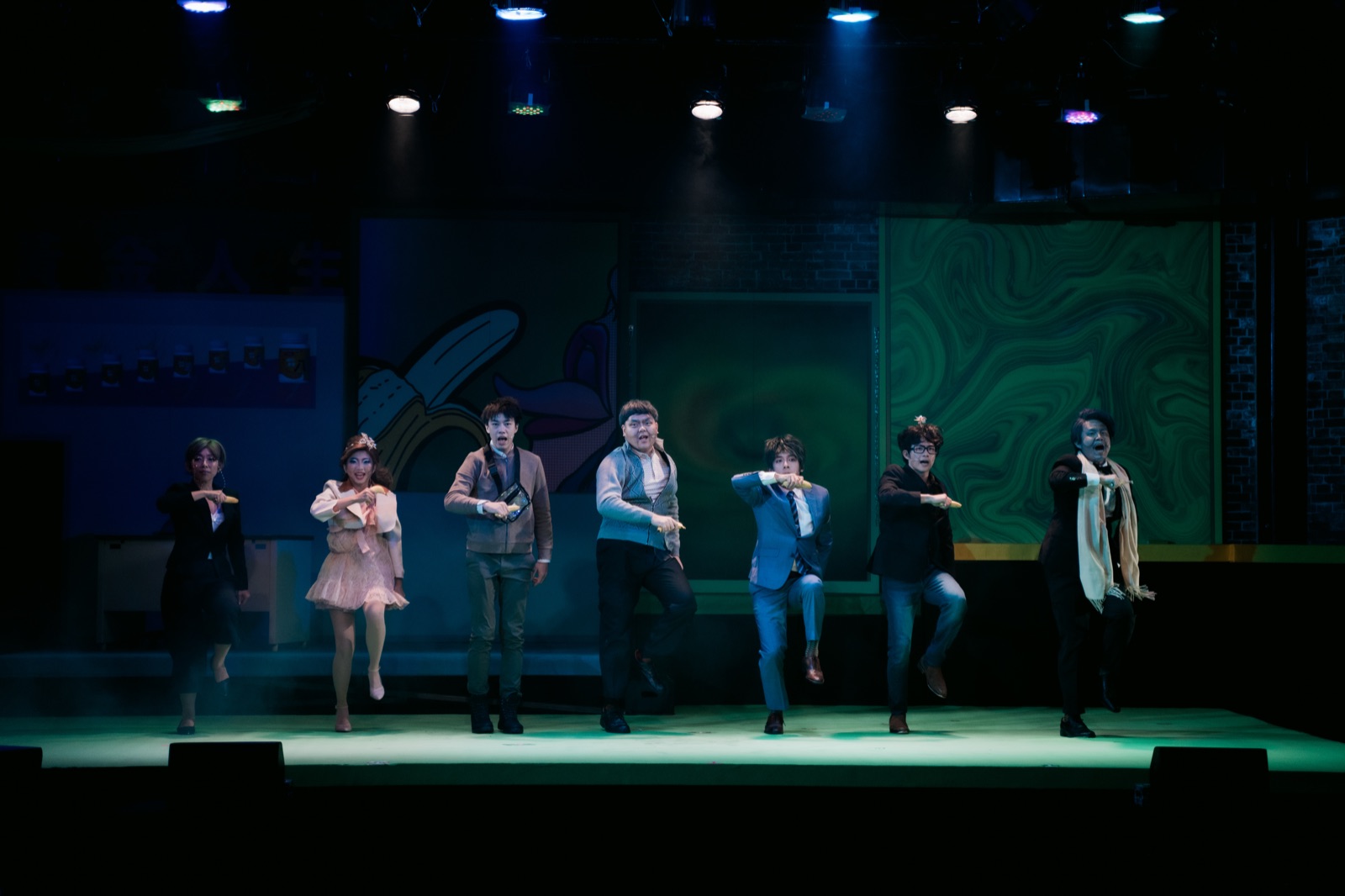 Full ensemble dance number in green light