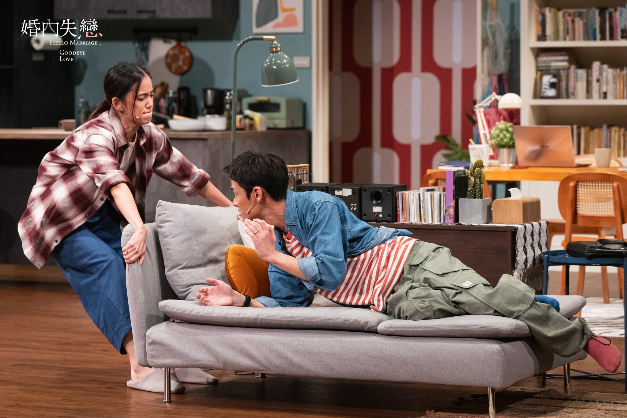 Couple argument on sofa in colorful living room