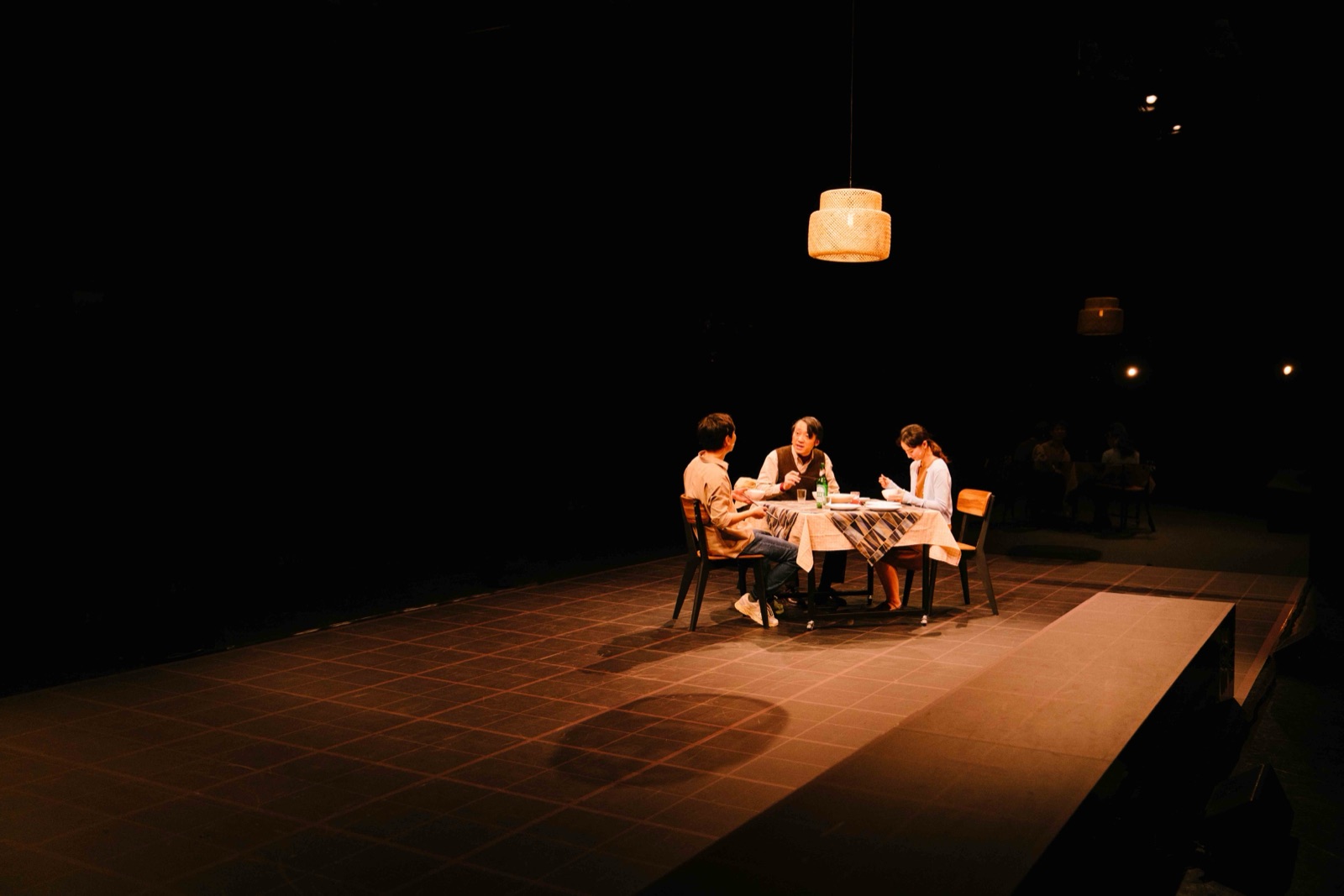 Family dinner under pendant lamp